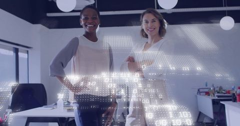 Digital Data Overlay with Confident Businesswomen in Modern Office