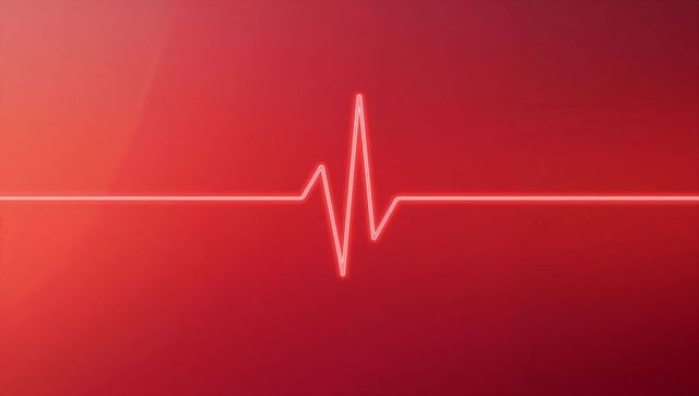 Ecg heartbeat waveform on red gradient background
