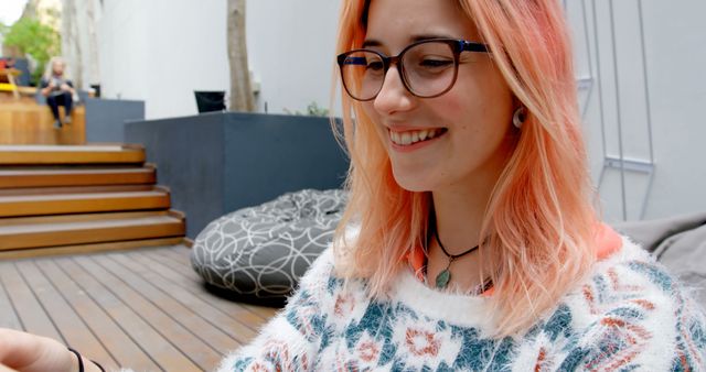 Smiling Woman with Pink Hair Working Outdoors on Laptop - Download Free Stock Images Pikwizard.com