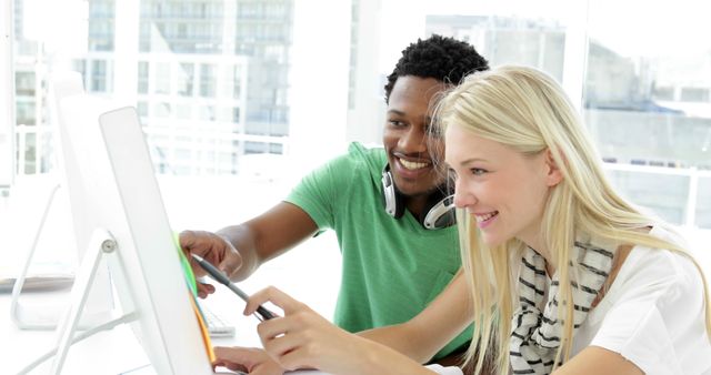 Young Coworkers Collaborating on Computer Project in Modern Office - Download Free Stock Images Pikwizard.com