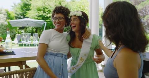 Women Celebrating Bridal Shower Outdoors Laughing Together