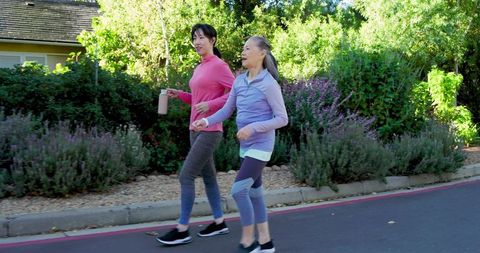 Asian Mother and Daughter Enjoying Morning Walk in Sportswear