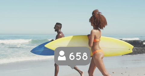 Surfing Couple Embracing Social Media Vibe on Sandy Beach - Download Free Stock Images Pikwizard.com