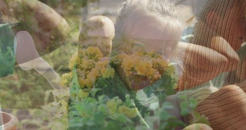 Family enjoying gardening with yellow flowers in backyard garden