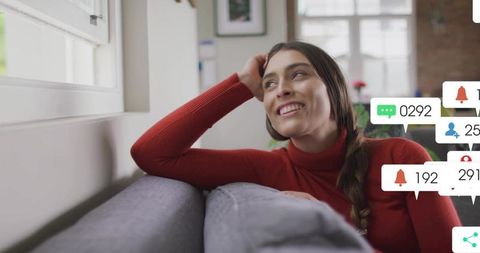 Woman Relaxing at Home with Social Media Engagement Icons