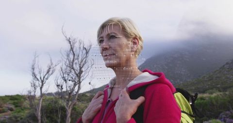 Woman Hiking in Misty Mountains with Geometric Overlay