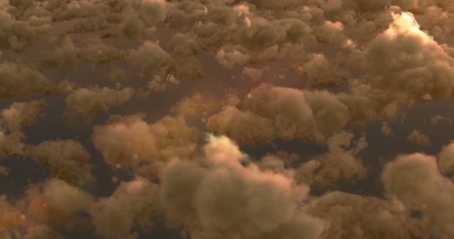 A vast expanse of golden clouds illuminated by a warm light, creating a serene and majestic atmosphere. The image captures the beauty and tranquility of a sky filled with clouds at sunset or sunrise.