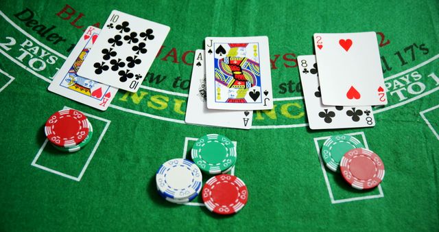 Close-Up View of Blackjack Table Layout with Playing Cards and Poker Chips - Download Free Stock Photos Pikwizard.com