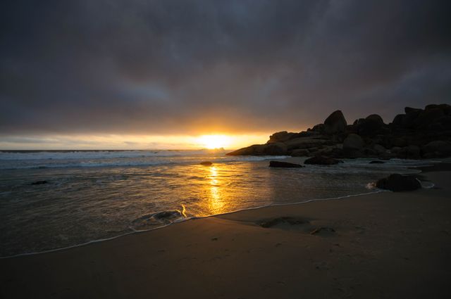Majestic Sunset Over Rocky Beach - Download Free Stock Photos Pikwizard.com