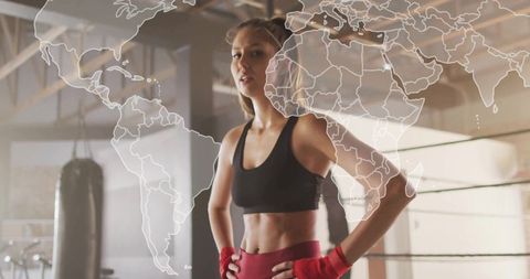 Fit Woman Training in Boxing Gym with World Map Overlay