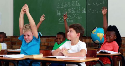Engaged School Kids Raising Hands in Math Class - Download Free Stock Images Pikwizard.com