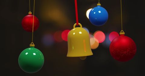 Colorful christmas baubles with bokeh lights background