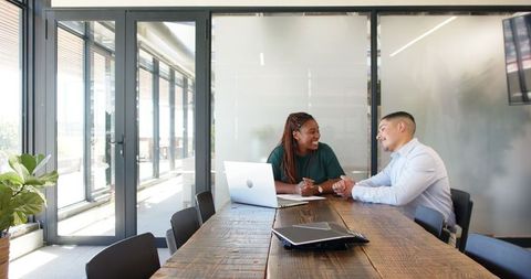 Business Professionals Collaborating in Modern Office Meeting