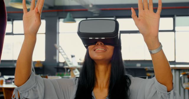 Excited Woman Using Virtual Reality Headset in Office Space - Download Free Stock Images Pikwizard.com