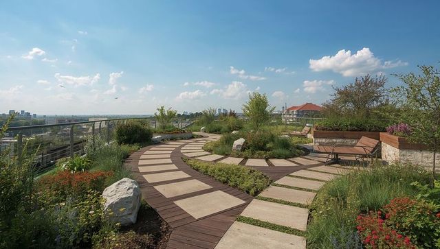 Curved wooden and stone walkway through sunlit rooftop garden with benches, skyline views