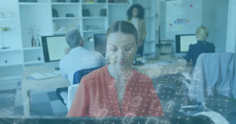 Woman Engaged in Digital Data Processing at Office Workspace