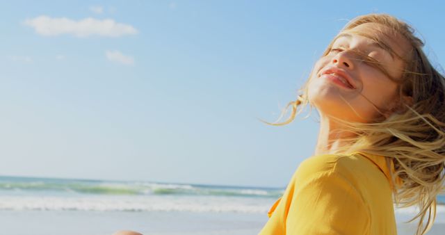 Joyful Woman Enjoying Sunny Beach Day at Ocean - Download Free Stock Images Pikwizard.com