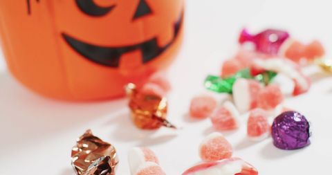 Halloween Candy Assortment and Pumpkin Bucket - Download Free Stock Images Pikwizard.com