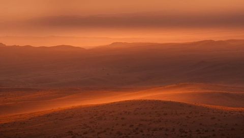 Glowing Layered Sand Dunes at Golden Hour Revealing Wind-Formed Ripples