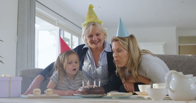 Family Celebrating Birthday at Home with Cake and Candles - Download Free Stock Images Pikwizard.com