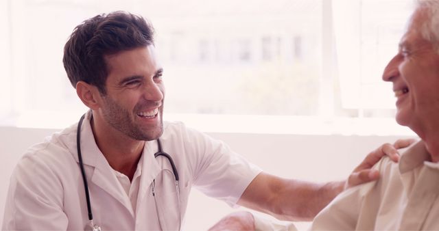 Friendly Doctor Providing Comfort to Elderly Patient with Warm Smile - Download Free Stock Images Pikwizard.com