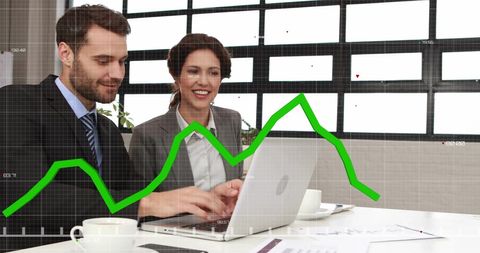 Team Analyzing Financial Data on Laptop in Office Setting