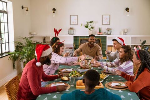 Family Holiday Celebration with Christmas Decorations and Toasting