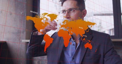 Executive sipping coffee while analyzing global data overlay in modern coworking space