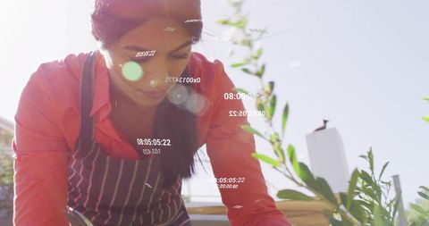 Woman gardening on rooftop with digital overlay effect