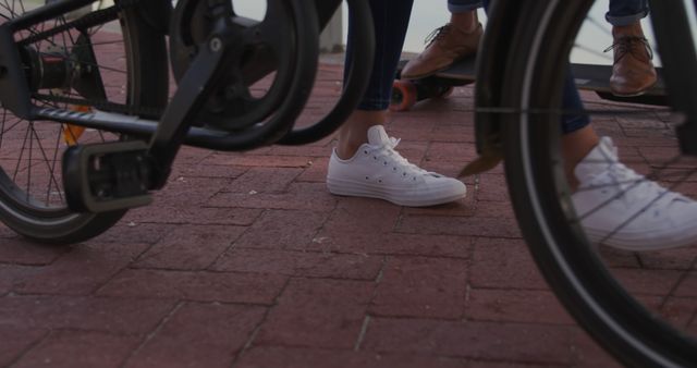 People Riding Bicycle and Skateboard on Urban Brick Sidewalk - Download Free Stock Images Pikwizard.com