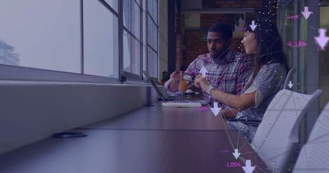 Diverse colleagues analyzing digital marketing in modern office