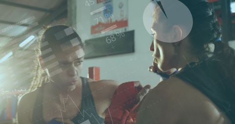 Digital Interface Overlay on Diverse Women Boxing at Gym