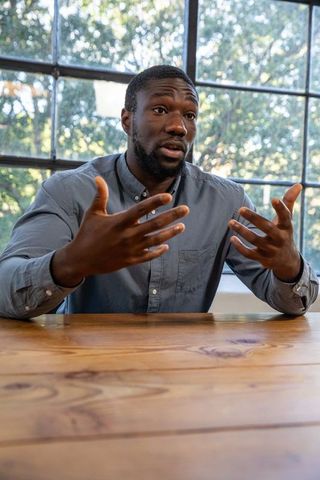 African American Professional Engaging in Workplace Discussion