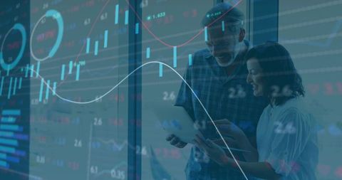 Collaborative team analyzing financial data on modern tablet with transparent chart overlay
