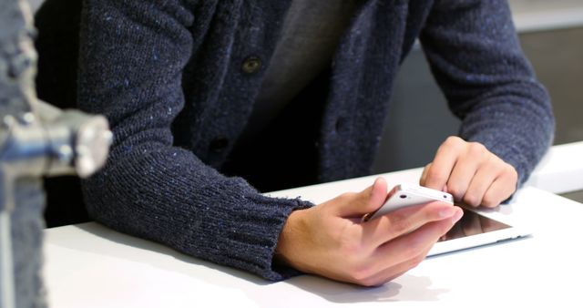 Person Using Smartphone and Tablet at Table Close Up - Download Free Stock Images Pikwizard.com