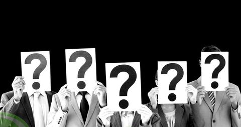 Conceptual Image of Mystery Figures Holding Question Marks