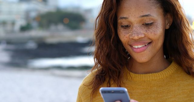 Smiling Woman Checking Smartphone Outdoors - Download Free Stock Images Pikwizard.com