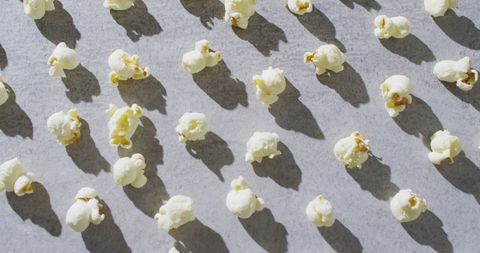 Popcorn Shadows Creating Playful Patterns on Gray Background - Download Free Stock Images Pikwizard.com