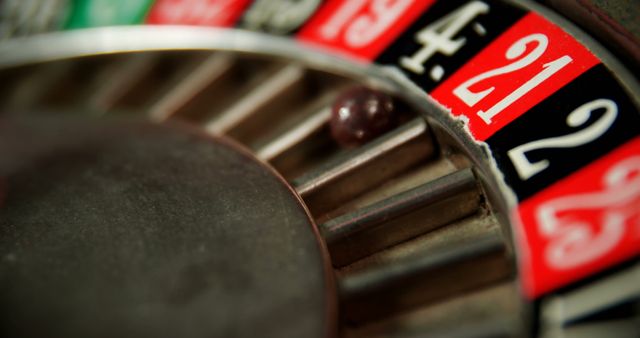 Close-up of spinning roulette wheel on poker table in casino - Download Free Stock Photos Pikwizard.com