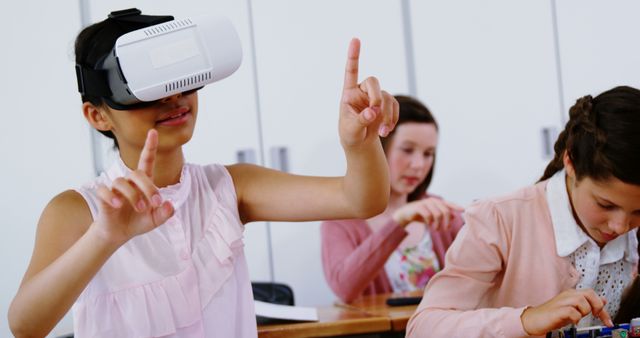 Students in a classroom are exploring virtual reality and STEM activities. One child is using a VR headset, fully immersed, while other students are engaged in hands-on science projects. Useful for illustrating modern classroom environments, educational technology, and interactive learning.