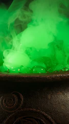 Vertical video - Bubbling green potion in cauldron emitting rising steam and bubbles