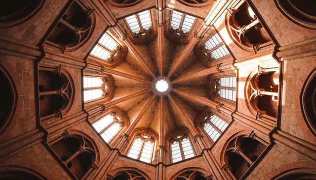 Octagonal dome showing radial ribs central oculus clerestory light sandstone rotunda