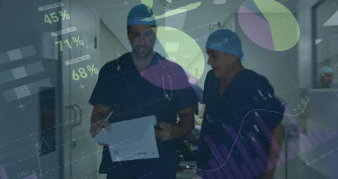 Doctors Analyzing Financial Data in Hospital Corridor