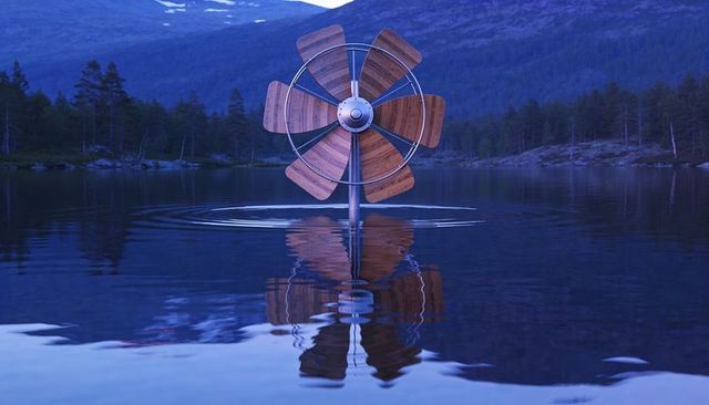 Wooden propeller rising from mirror lake at dawn creating ripples and reflection