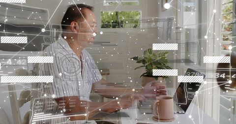 Chinese man typing and working on laptop in bright home office with digital data overlay