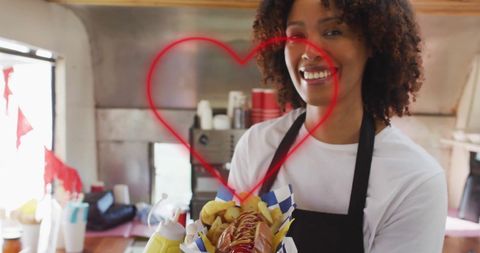 Joyful Vendor Offering Delicious Hot Dog in Food Truck - Download Free Stock Images Pikwizard.com