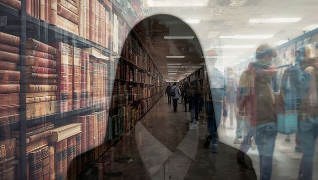 People Walking in Library Hallway with Map-Marker Overlay