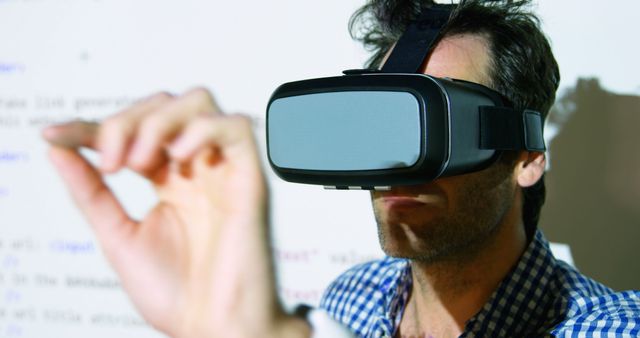 Man Experiencing Virtual Reality with Headset and Hand Gestures - Download Free Stock Images Pikwizard.com