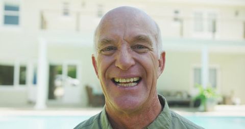 Smiling Senior Man Relaxing Outdoors by Pool - Download Free Stock Images Pikwizard.com