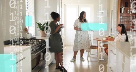 Three Women Chatting in Bright Modern Kitchen Holding Cups and Plates with Binary Overlay